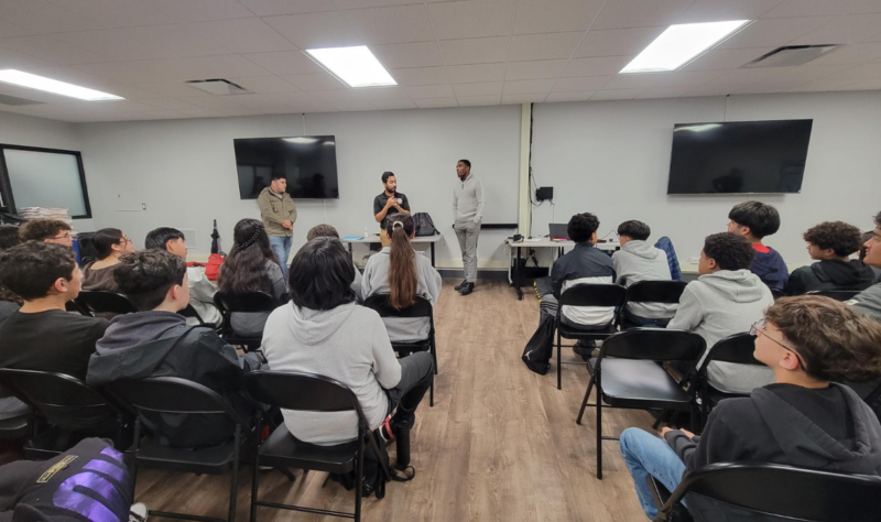 Simon Rodriguez, City of Aurora Youth Services Manager, speaking to FRMA students